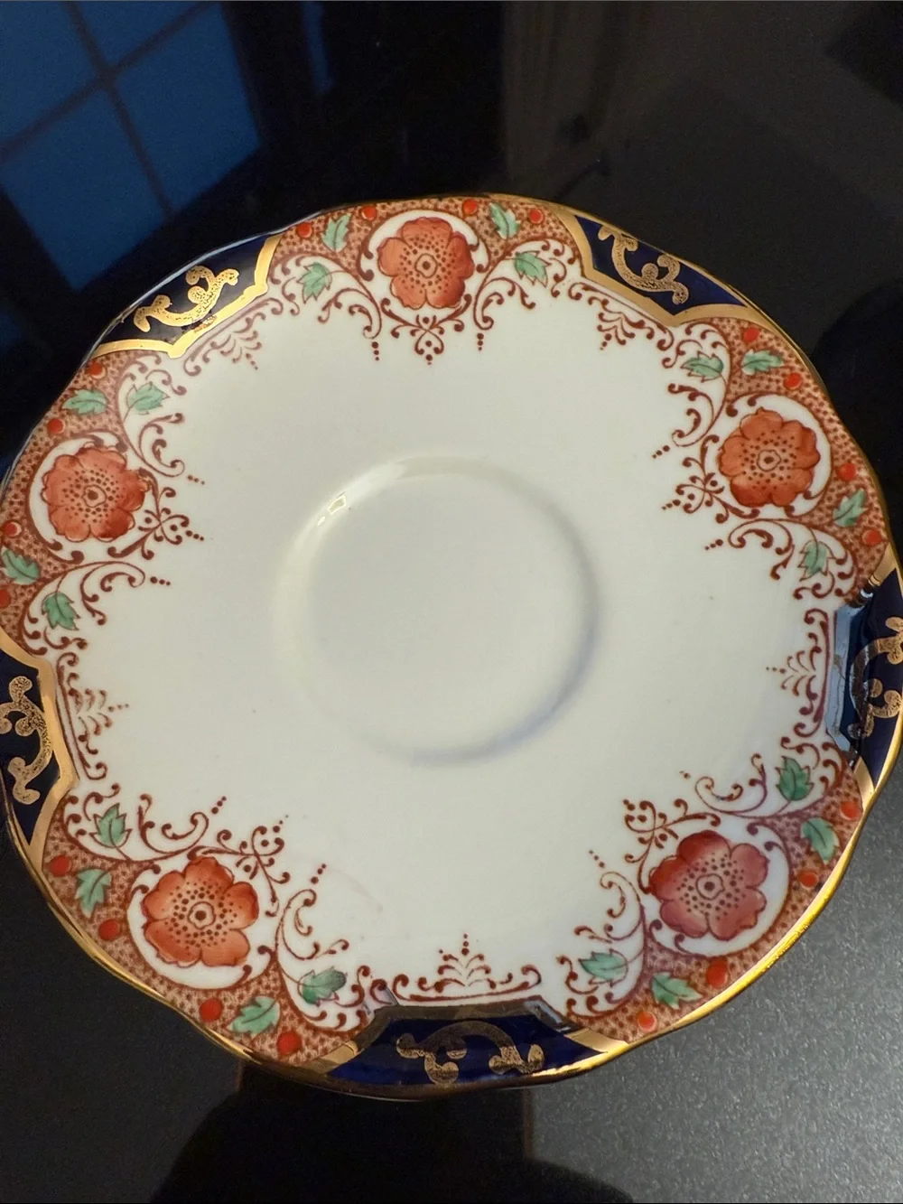 Decorative White and Navy Porcelain Tea Cup with Gold Accents
